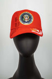 This Presidential Seal 45th President Signature Hat is class act. Trump's famous signature is embroidered in gold. Pictured in Red. 