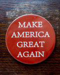 Red Ceramic MAGA Coaster or set of Coasters.  Sold individually or in 6-packs.  Each coaster is 2-1/2" round with cork backing. 