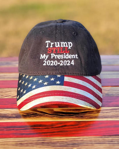 Show them how you really feel wearing this TRUMP STILL MY PRESIDENT 2020-2024 embroidered in white and red on the front. Available in Black with American Flag design bill and adjustable fabric strap. #TrumpStillMyPresident #Trump2020 #Trump2024