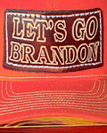 Rock our Trucker-Style Let's Go Brandon Leather Patch Hat with white mesh back.  The leather patch is custom made, hand-cut, and hand-stamped in the USA. Available in Orange + 2 other colors (see Red and Pink).