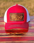 Trucker-Style Trump 2024 Leather Patch Hat with white mesh back.  The leather patch is custom made, hand-cut, and hand-stamped in the USA. Available in Red. 