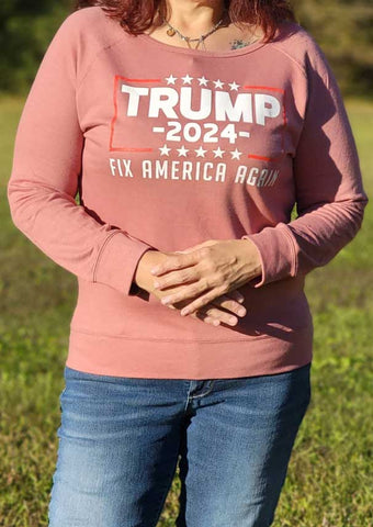 Enjoy this super soft "Trump 2024 Fix America Again" women's sweatshirt. Available in Dusty Pink. 60% cotton, 40% polyester. Size S-XXL. 