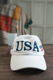 Sport your USA support with this White USA 45 Hat.  Available in White with Navy Blue stitching.  45 on one side, American flag on the other.  One Size.