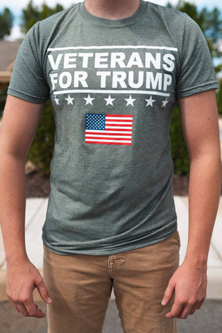 A Classic Veterans For Trump American Flag T-Shirt. Available in Army Green (Long-Sleeve) and Heather Grey (Short-Sleeve).  Size M-XXXXL.