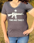 Make a statement in support of the 2nd Amendment in our Women's Come and Take It V-Neck, Short-Sleeve Tee.  Available in Independence Red and Charcoal Grey with white messaging. 50% polyester,  25% cotton, 25% rayon. Size S-XXL. 