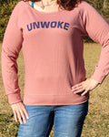 Enjoy our super soft Women's UNWOKE Sweatshirt in long-sleeve. Available in Dusty Pink with navy blue messaging. Size S-XXL. 